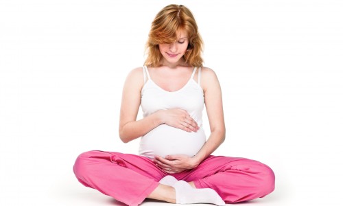 Close-up of a pregnant woman's sitting